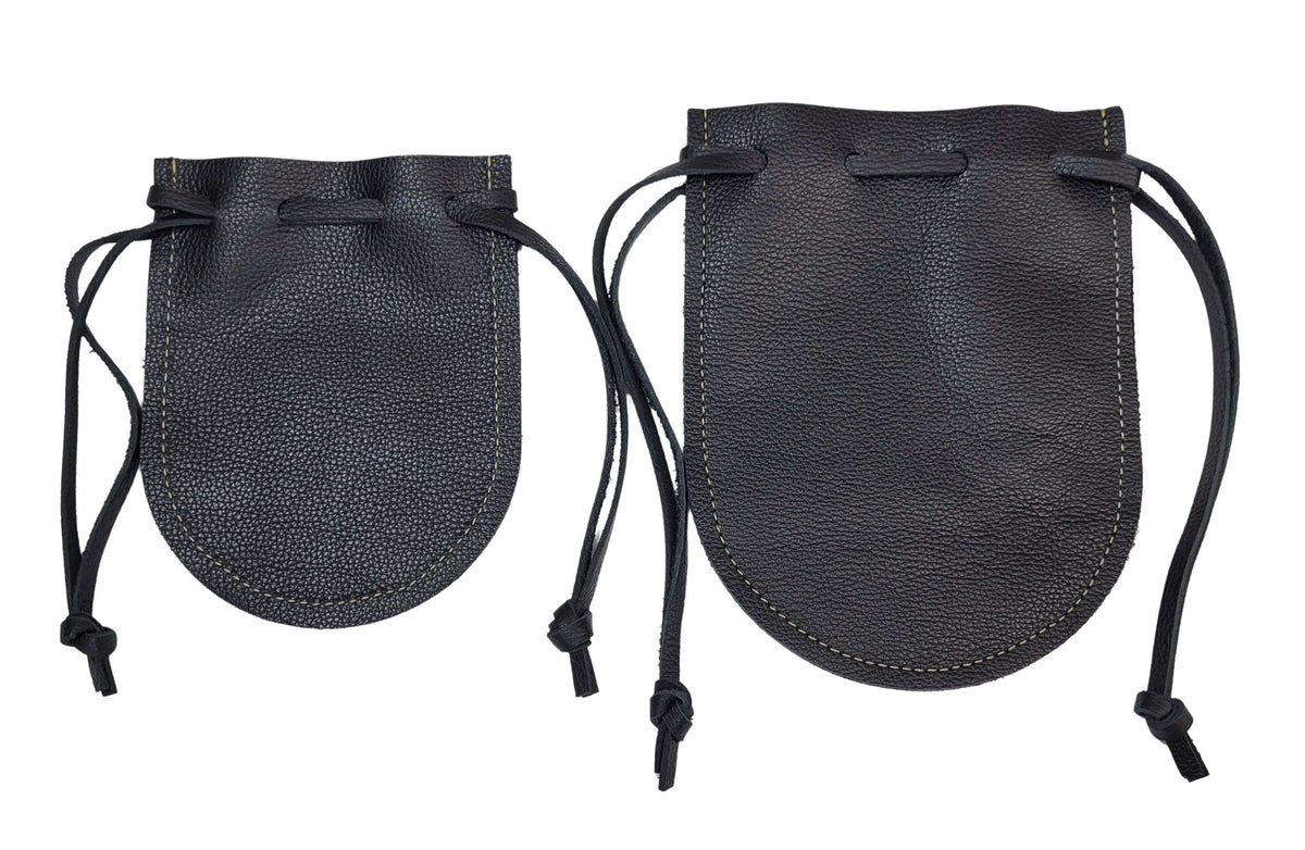 Handcrafted black leather drawstring pouches.  Showing the differences of sizes.  Made in the USA.  Perfect for dice, coins, jewelry, and everyday carry.