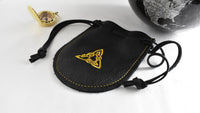 Handcrafted black leather drawstring pouch featuring a gold embroidered triangle design for everyday carry, travel, dice, and collectibles.  Made in the USA