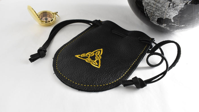 Handcrafted black leather drawstring pouch featuring a gold embroidered triangle design for everyday carry, travel, dice, and collectibles.  Made in the USA